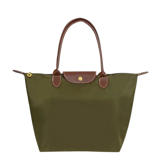 Durable nylon women's shoulder bag, elegant and practical. Spacious everyday handbag for organized essentials.
