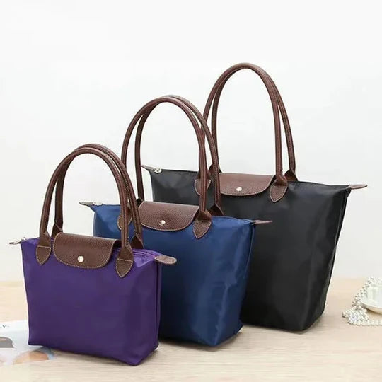 Sophisticated women's shoulder bag, elegant design. Spacious nylon handbag, perfect for stylish everyday organization.