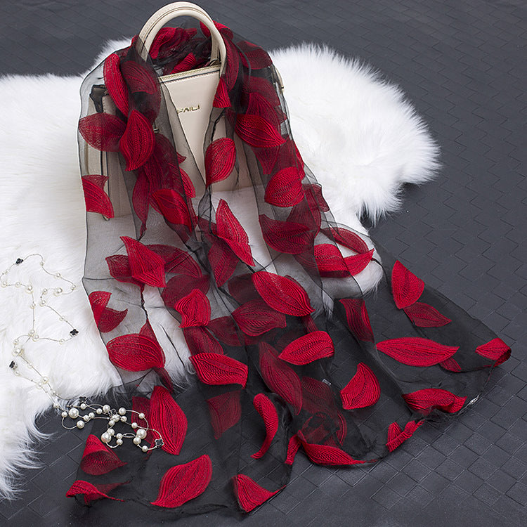 Luxury floral cut-out silk scarf, a must-have fashion accessory for women.
