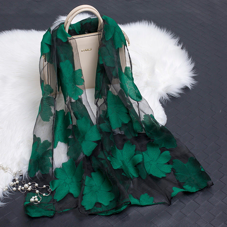Trendy women's lightweight silk floral scarf with distinctive cut-out patterns.