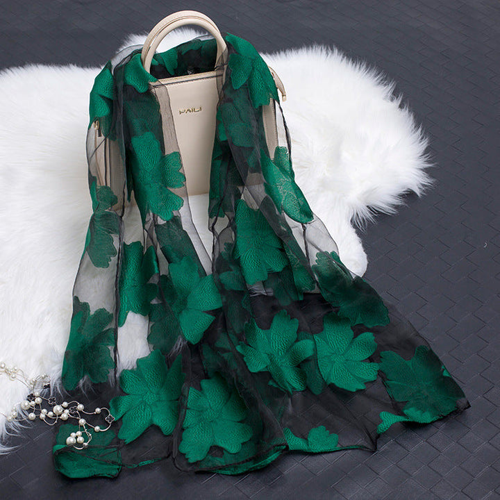 Trendy women's lightweight silk floral scarf with distinctive cut-out patterns.