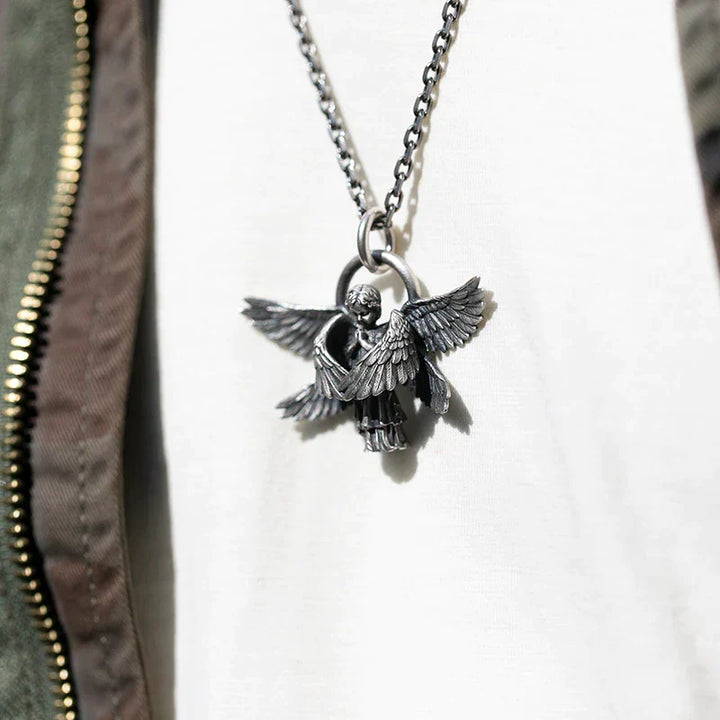 Close-up of a stunning silver angel wing necklace, a divine women's pendant.