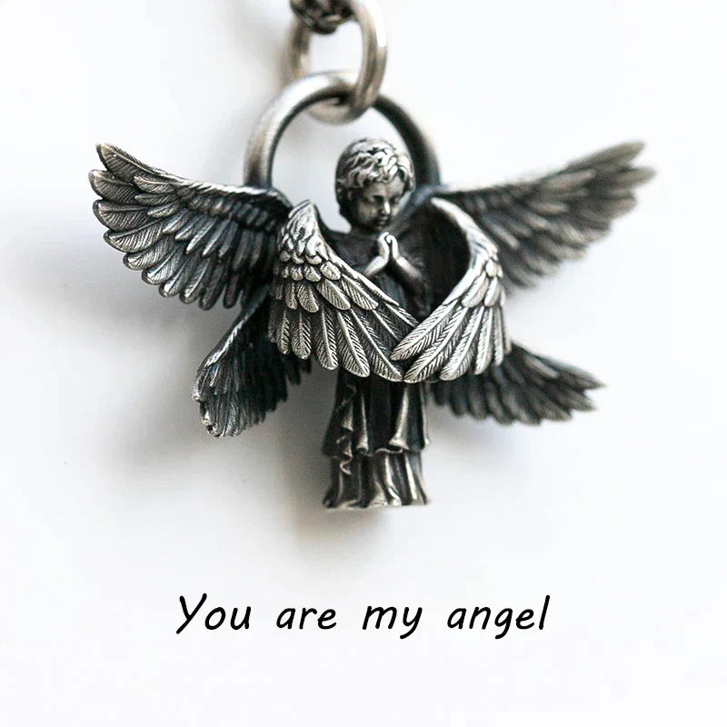 Detailed silver angel wing necklace, an elegant women's jewelry item perfect as a gift.