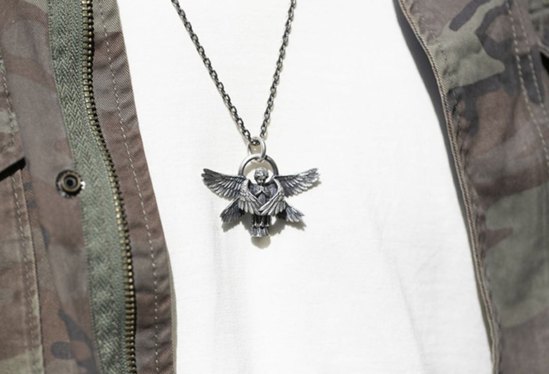 Symbolic silver angel wing pendant, an elegant celestial necklace for women.