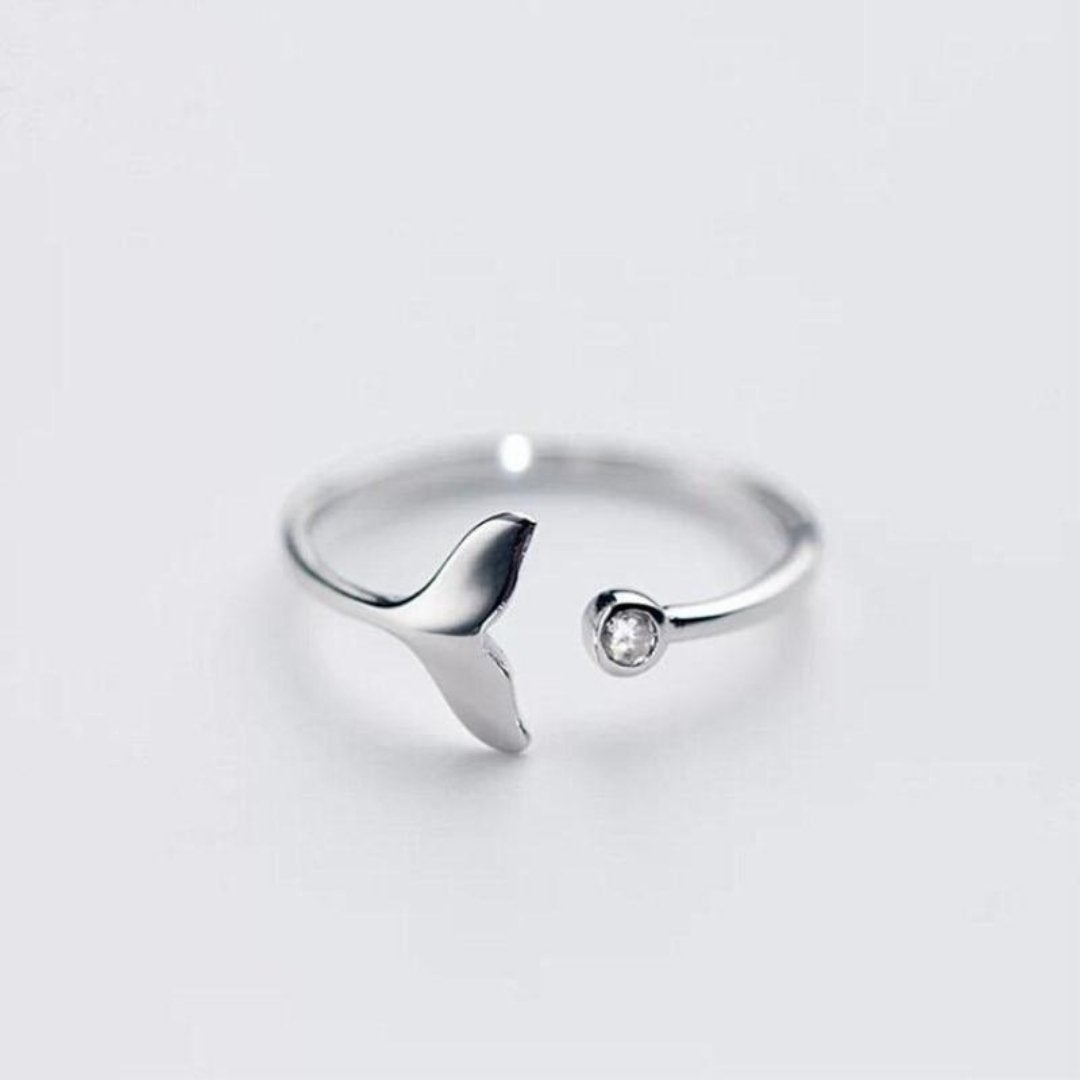 Elegant women's silver dolphin tail ring with sparkling adjustable zirconia, perfect ocean-inspired jewelry.