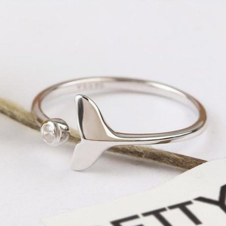 Fashionable women's silver dolphin tail ring with brilliant zirconia, adjustable for a perfect fit. Marine jewelry.