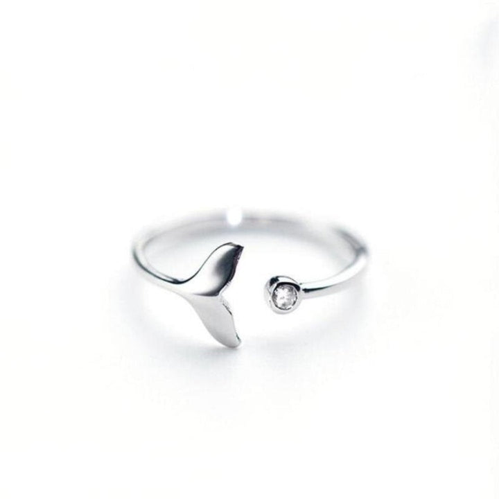 Stunning sterling silver dolphin tail ring for women, featuring dazzling adjustable zirconia stones. Ocean fashion.