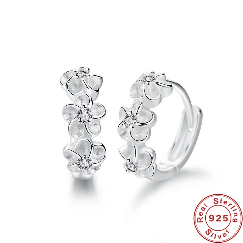 Elegant women's silver floral earrings. Delicate sterling silver jewelry with push-back design, perfect gift.