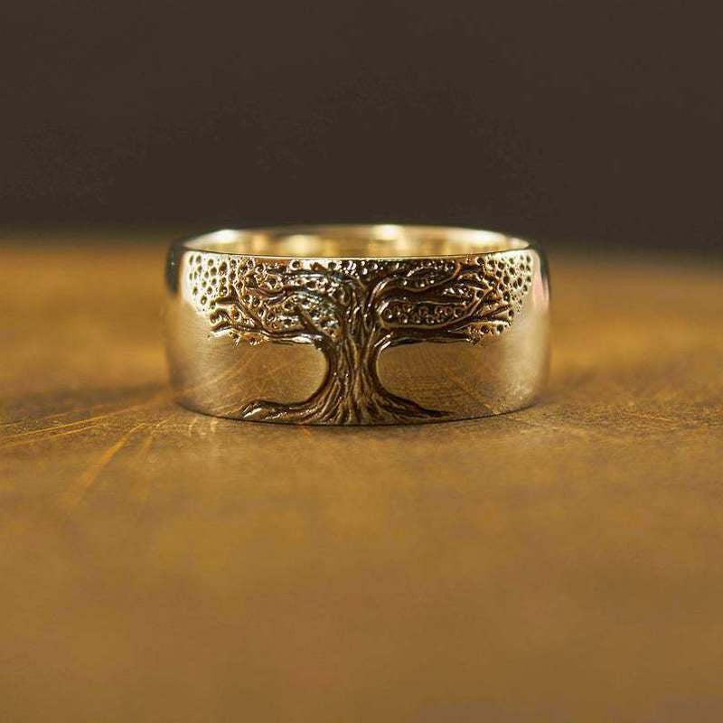 Elegant women's silver & gold Tree of Life ring. Nature-inspired symbolic jewelry and fashion accessory.