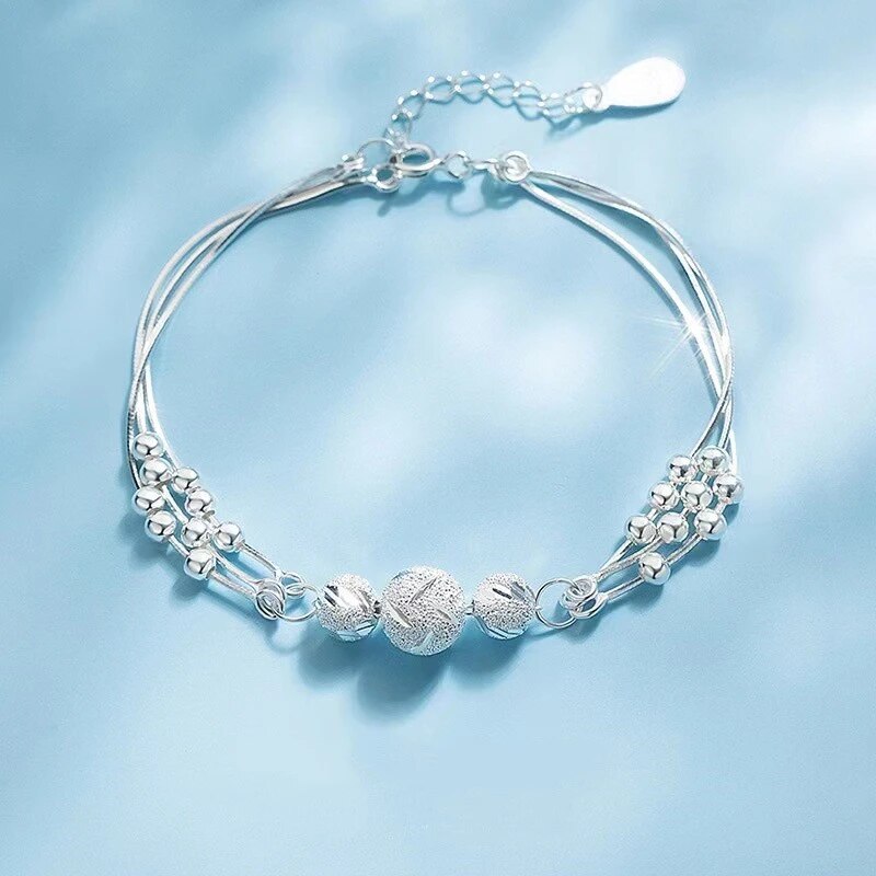 Elegant women's silver pearl bracelet with natural pearls. Versatile sterling silver jewelry for any occasion.