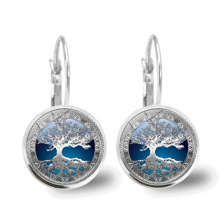 Symbolic silver Tree of Life drop earrings for women, featuring intricate design and elegant dangle.
