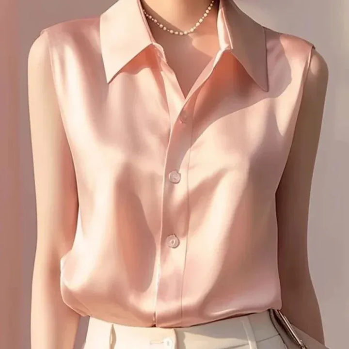 Chic women's sleeveless button blouse, designed for a polished style, great for office wear & elegant casuals.