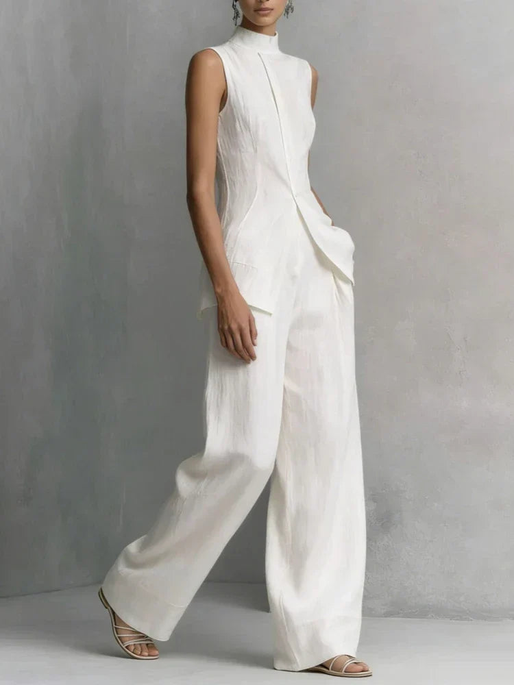 Modern women's sleeveless jumpsuit featuring a high neck and flowing wide leg design, ideal for an elegant look.