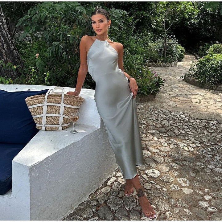 Elegant women's sleeveless maxi dress with thin straps, perfect for parties & summer evenings. Comfortable & stylish.