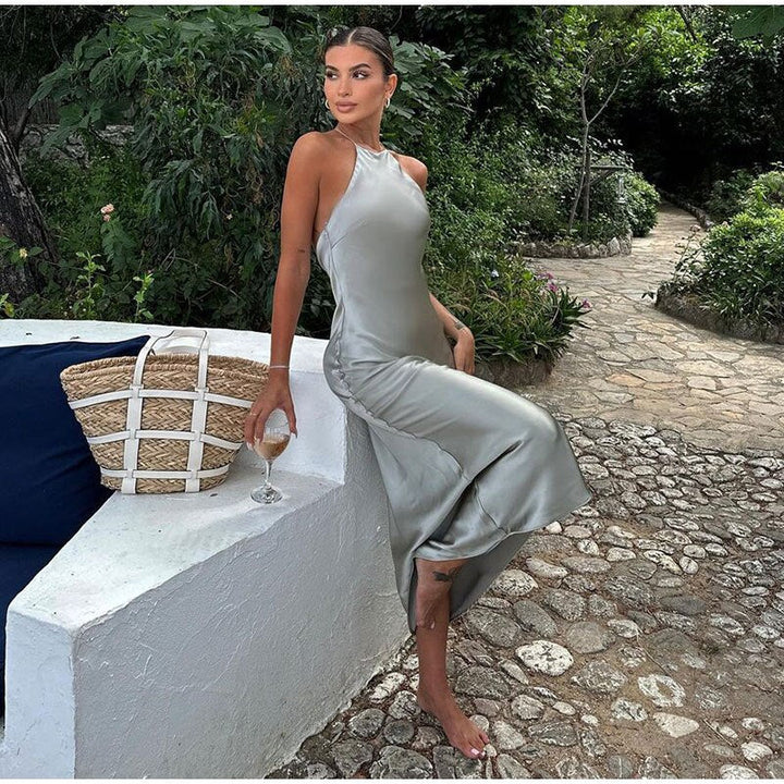 Strappy sleeveless maxi dress for women, featuring an elegant design and comfortable wrap effect. Ideal for summer parties.