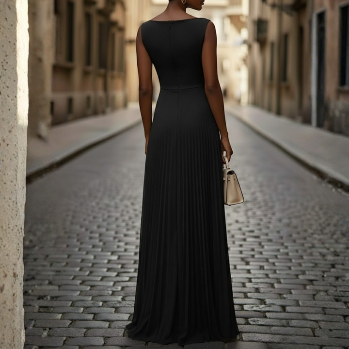 Comfortable sleeveless maxi dress for women, featuring a boat neck and flowing pleats for a stylish look.