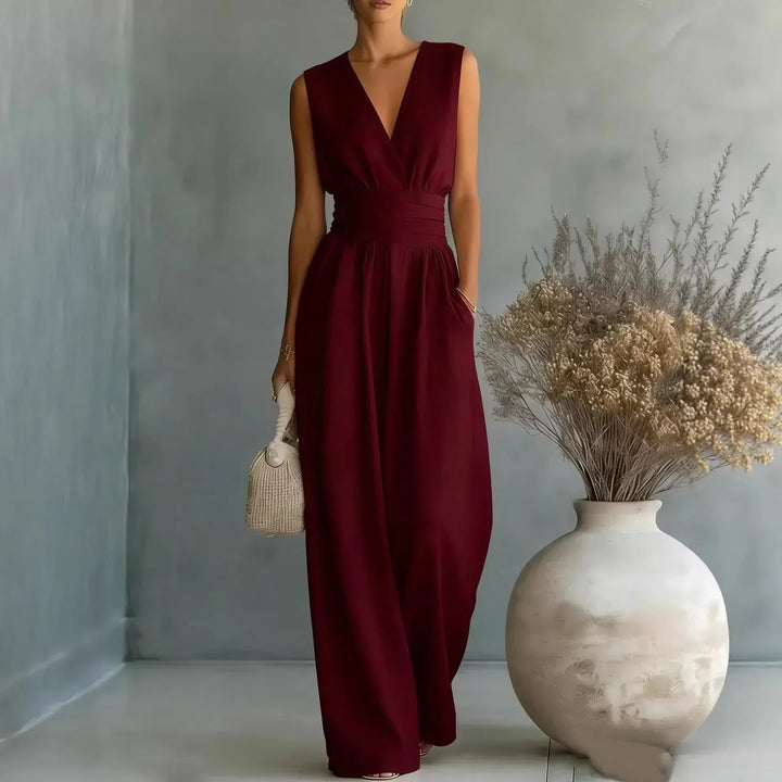Chic women's sleeveless wide-leg V-neck jumpsuit with a high waist. A versatile one-piece outfit.