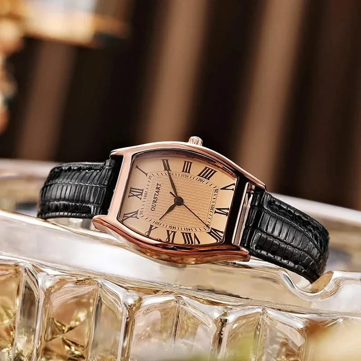 Stylish women's slim wristwatch worn on wrist, featuring classic Roman numerals; an elegant accessory for any outfit.