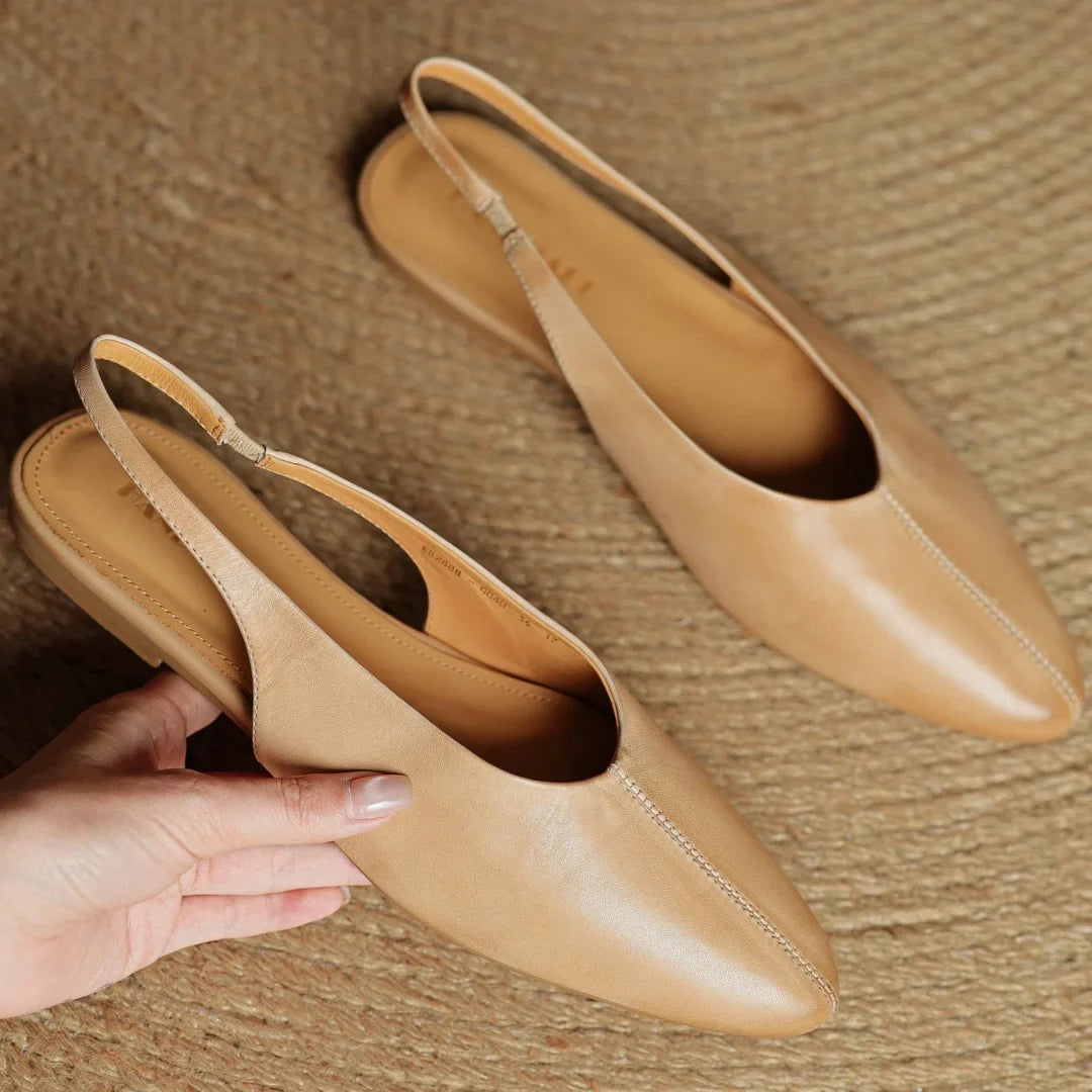 Women's elegant slingback flats, emphasizing comfort and style. Classic everyday footwear choice.