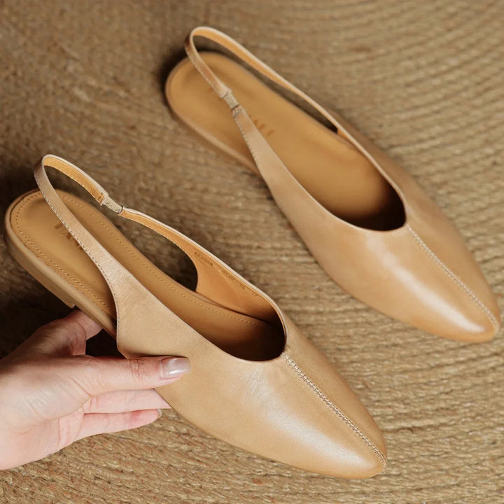 Women's elegant slingback flats, emphasizing comfort and style. Classic everyday footwear choice.