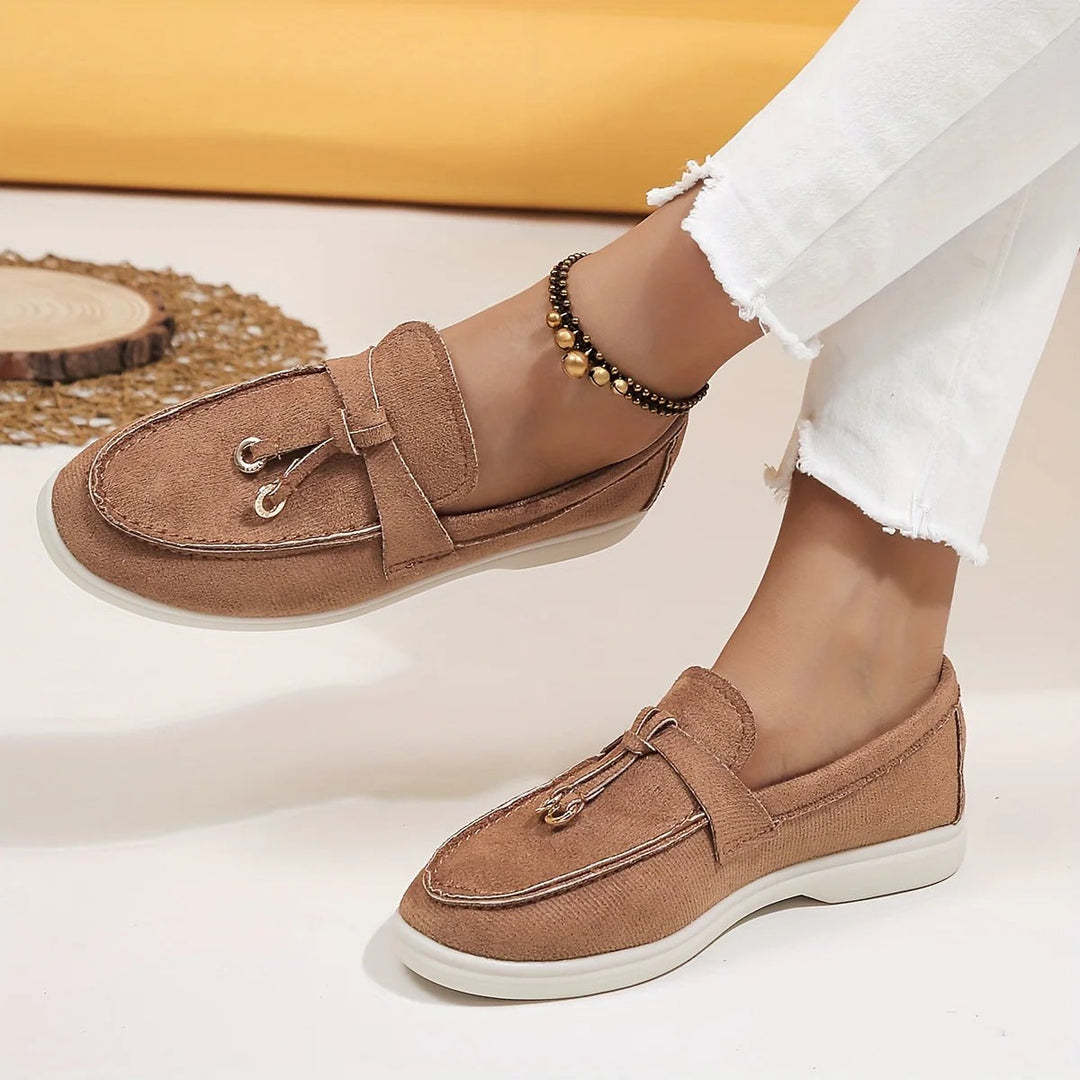 Elegant women's slip-on loafers with chic tassel detail. Comfortable and versatile for classic everyday style.