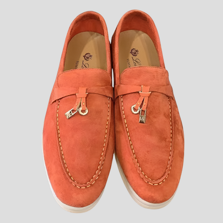 Black women's tassel detail slip-on loafers, offering versatile comfort and timeless elegance for any outfit.