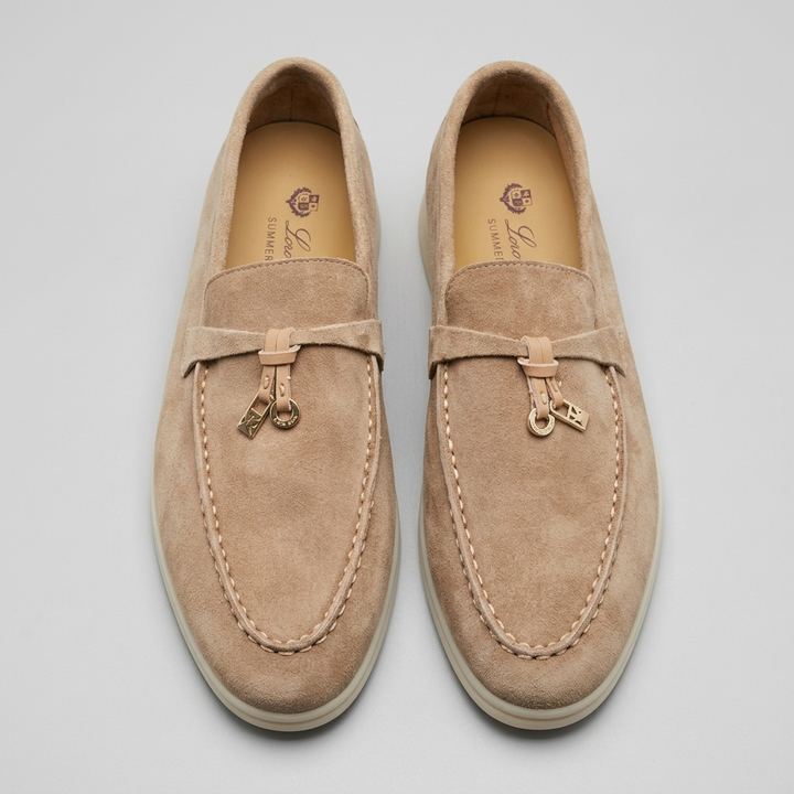 Stylish women's footwear: slip-on loafers with chic tassel details, blending comfort, classic design, and versatility.