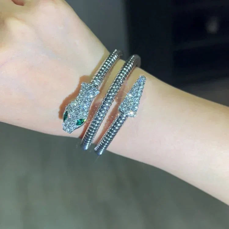 Chic gold snake bracelet for women, a luxurious and elegant fashion accessory. Adjustable bangle for a comfortable fit.