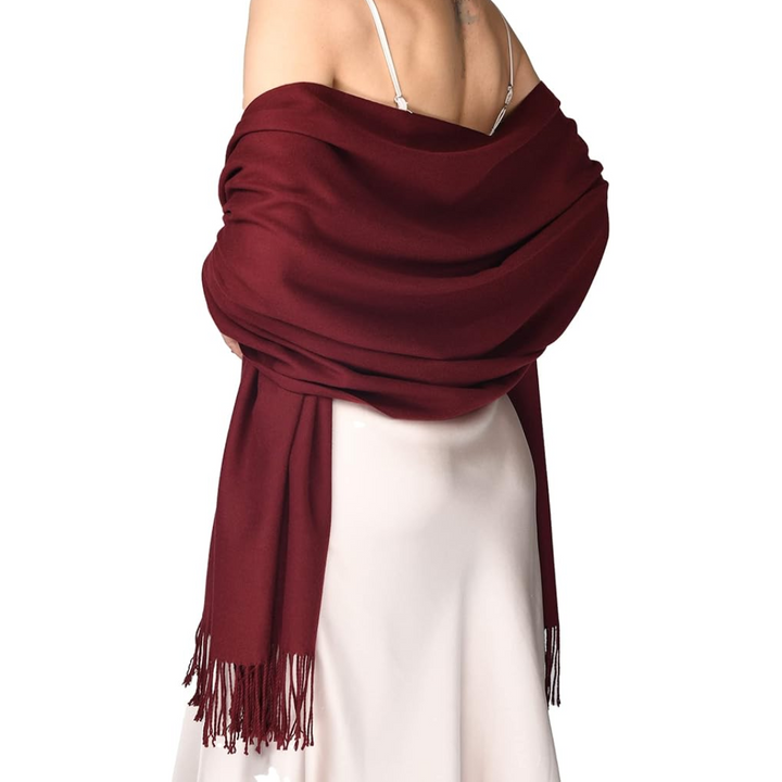 Elegant women's soft cashmere-feel pashmina scarf in a classic solid color, perfect for winter fashion.