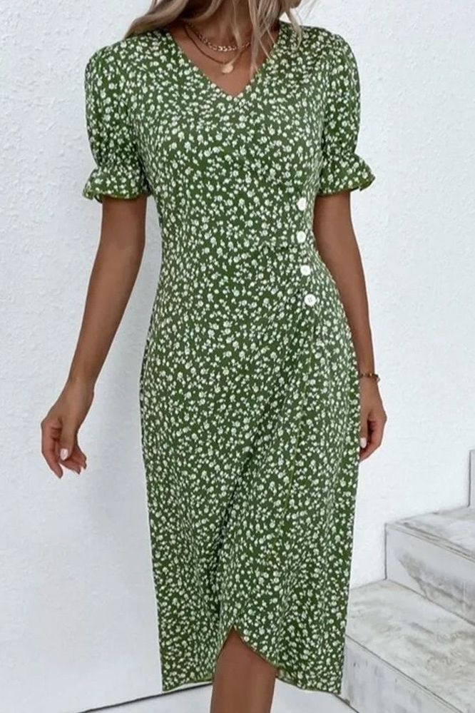 Close-up of soft pleats on an elegant women's midi dress, showcasing comfortable fabric and texture.