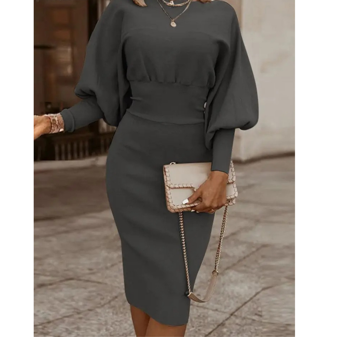 Sophisticated women's solid cocktail dress. Midi length with unique lantern sleeves for elegant evening wear.
