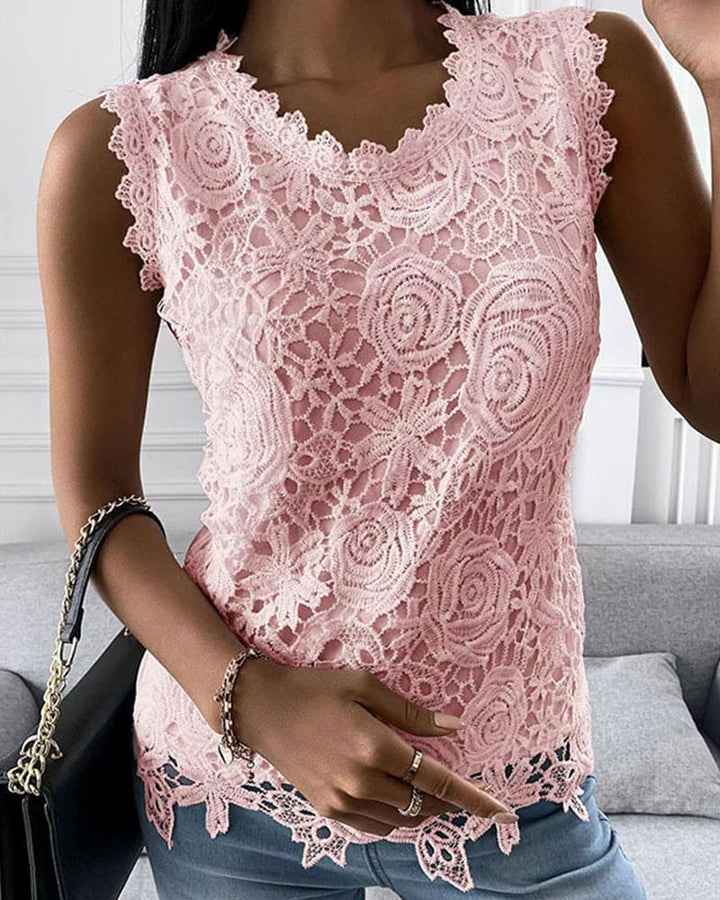 Chic solid color sleeveless blouse for women, featuring a round neck and exquisite lace detailing. Summer ready.