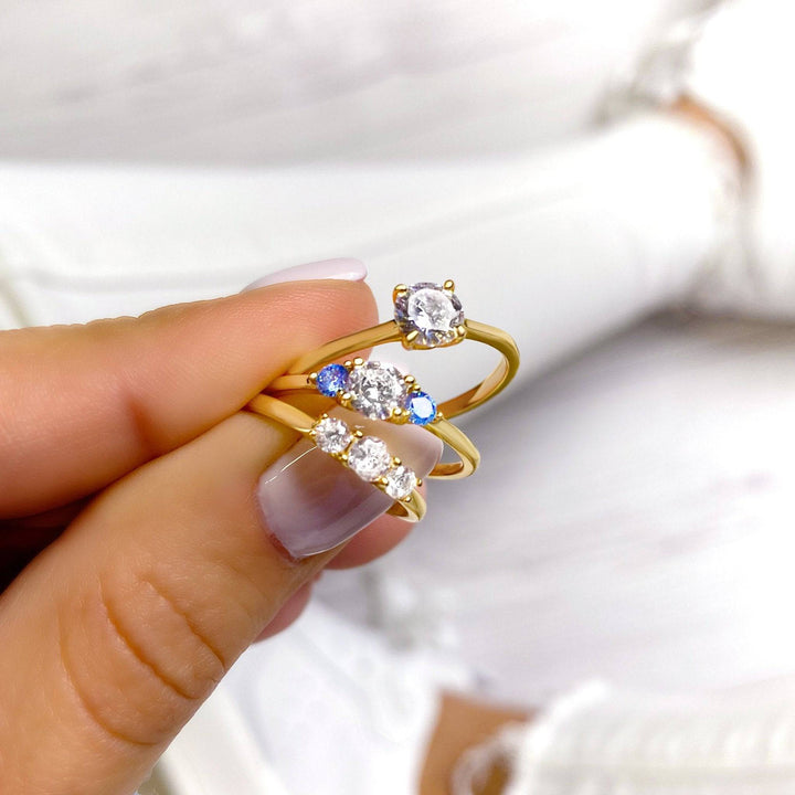 Sterling silver or gold plated women's solitaire zirconia ring, featuring a dazzling, elegant stone.