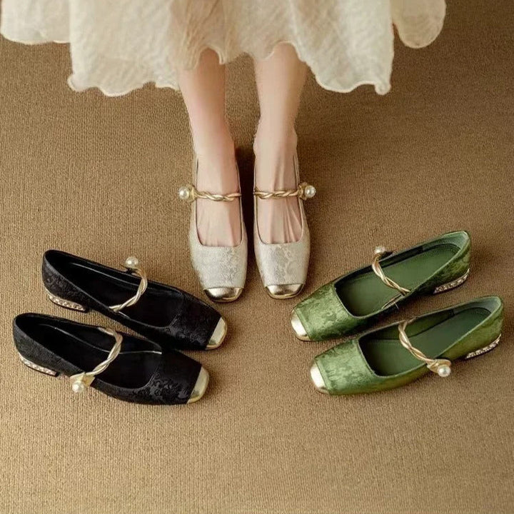 Full view of women's sparkling Mary Janes, elegant low heel, pearl strap. Perfect for special occasions.