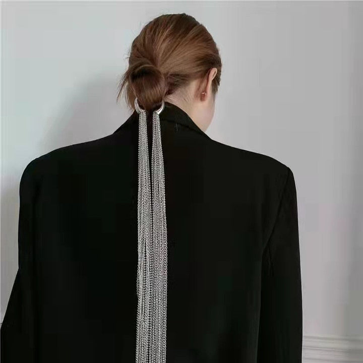 Elegant women's sparkling metal tassel hair clip. Chic fashion accessory for versatile hairstyles. Perfect for special occasions.