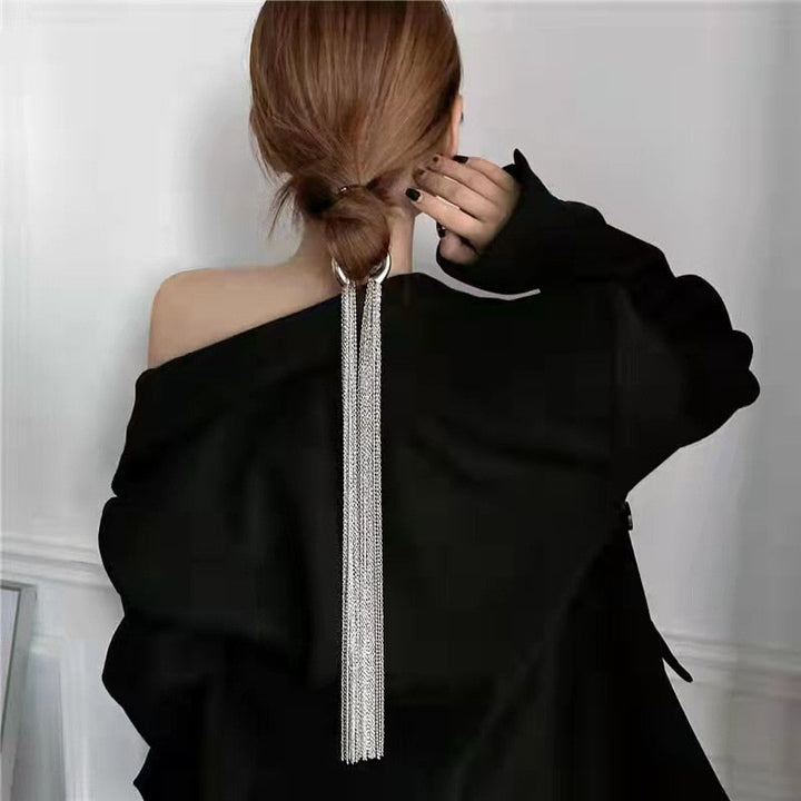 Chic women's sparkling metal tassel hair clip adds elegant flair to any hairstyle. Versatile fashion accessory for daily wear or events.