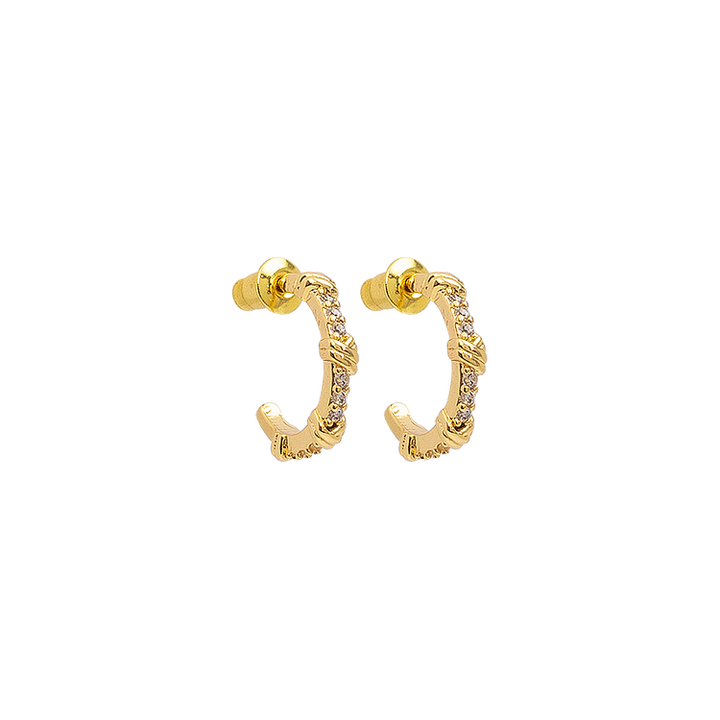 Close-up of sparkling open hoop earrings for women, featuring brilliant gemstones. Stylish and modern.