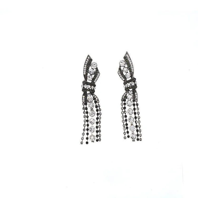 Elegant women's sparkling silver butterfly bow pendant earrings, perfect for formal occasions.