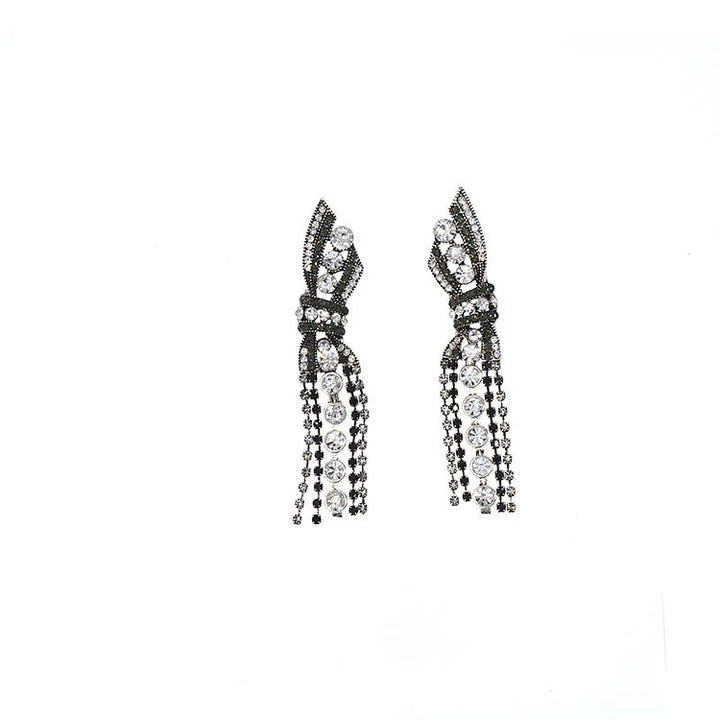 Beautiful sparkling butterfly and bow pendant earrings in silver for women, elegant design.