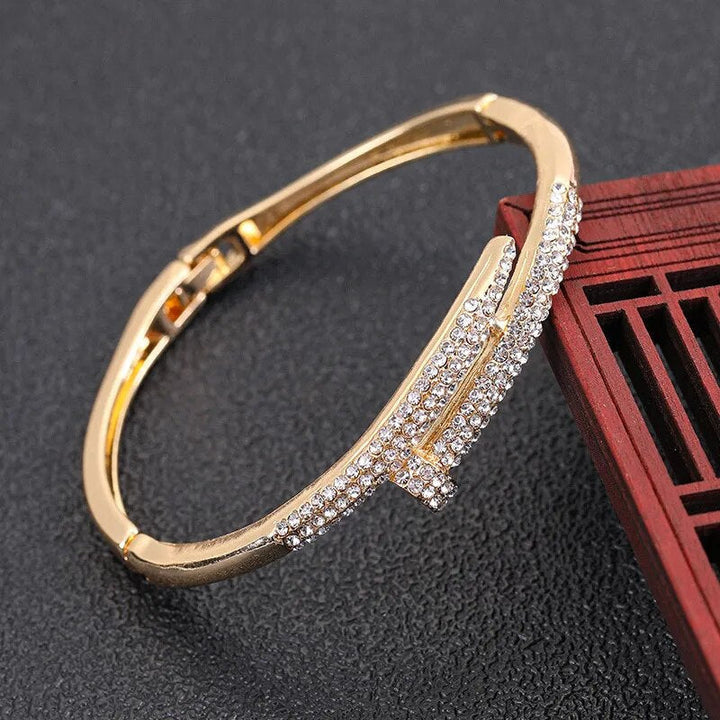 Elegant women's sparkling zircon nail bracelet, gold plated, perfect fashion accessory for any occasion.