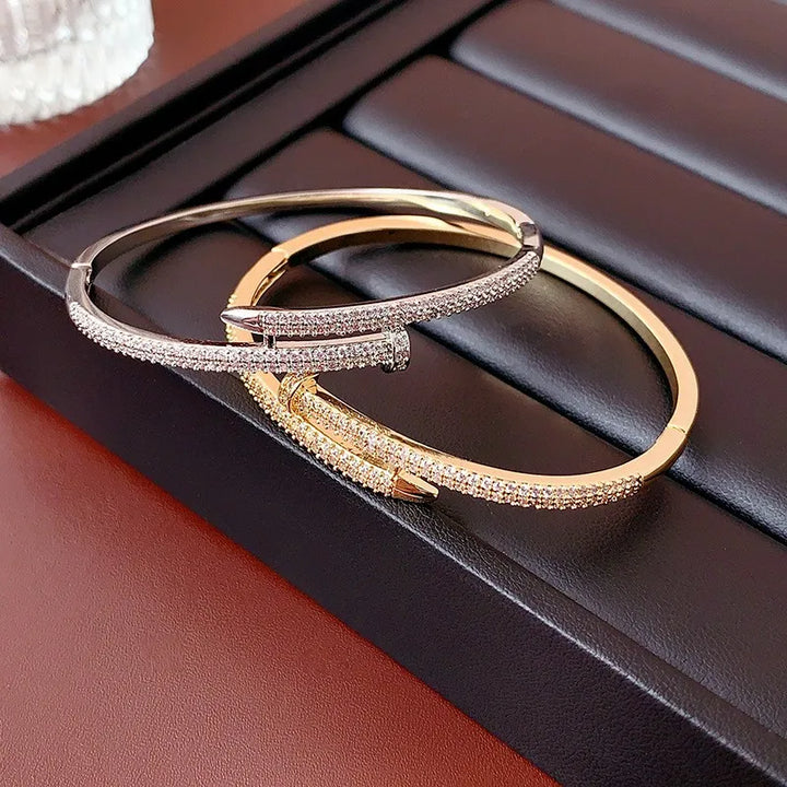 Silver-tone women's sparkling zircon nail design bracelet, an elegant and timeless fashion accessory.
