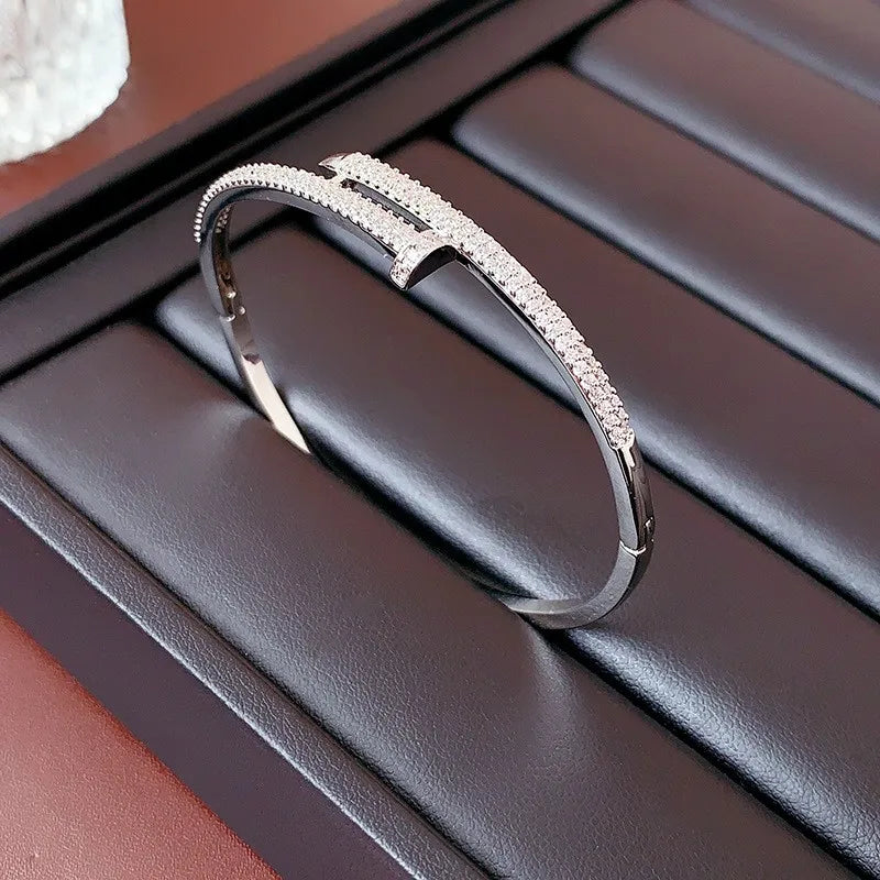 Adjustable women's sparkling zircon cuff bracelet with elegant nail design, a perfect jewelry gift for her.