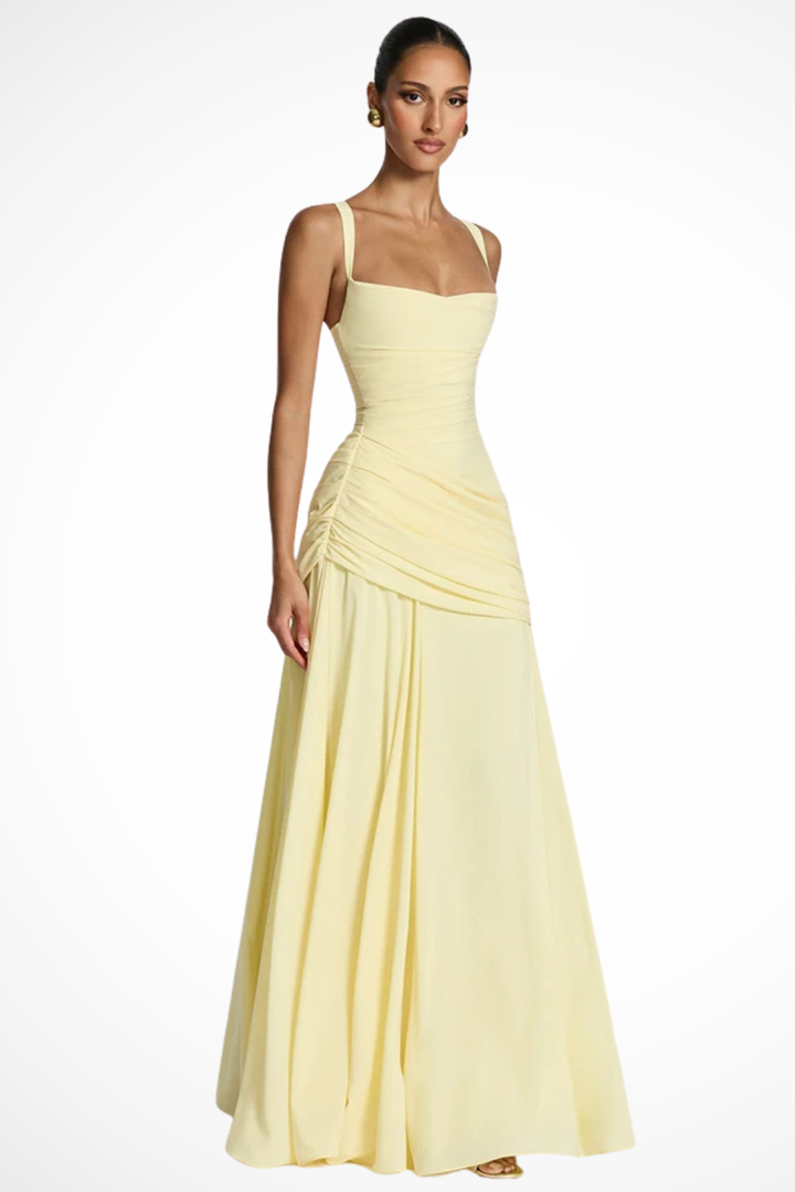Full-length view of a women's formal wedding guest dress, elegant square neck & ruched silhouette.