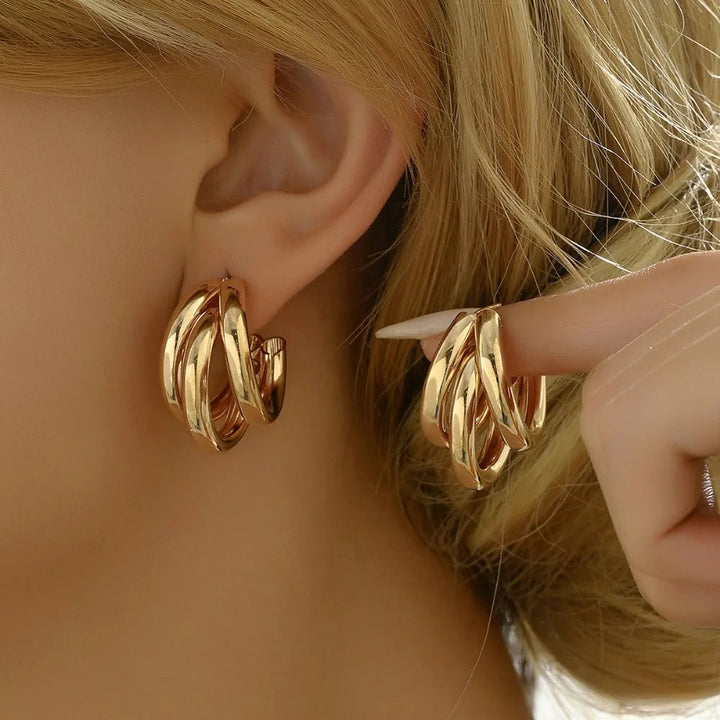Elegant women's stacked hoop earrings in a chic gold and silver finish, perfect fashion jewelry.