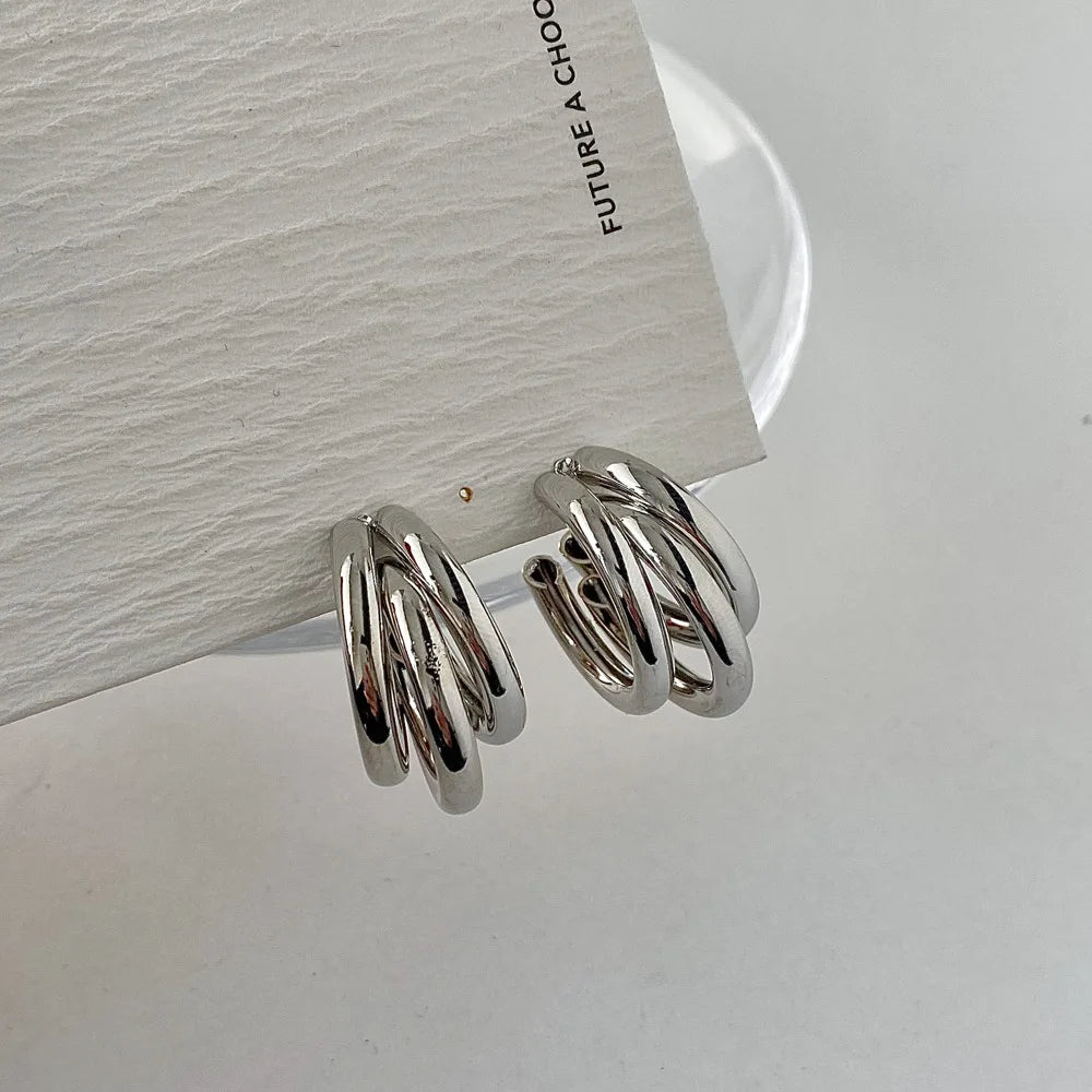 Stylish women's stacked hoop earrings, featuring elegant gold and silver, ideal for modern fashion jewelry.