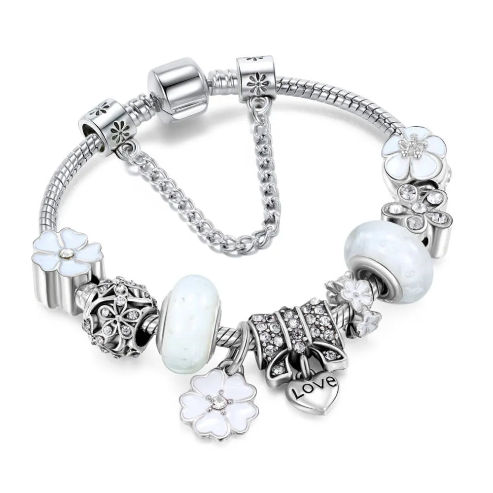 Women's stainless steel peach blossom bracelet with detailed floral charms, an exquisite gift for her.