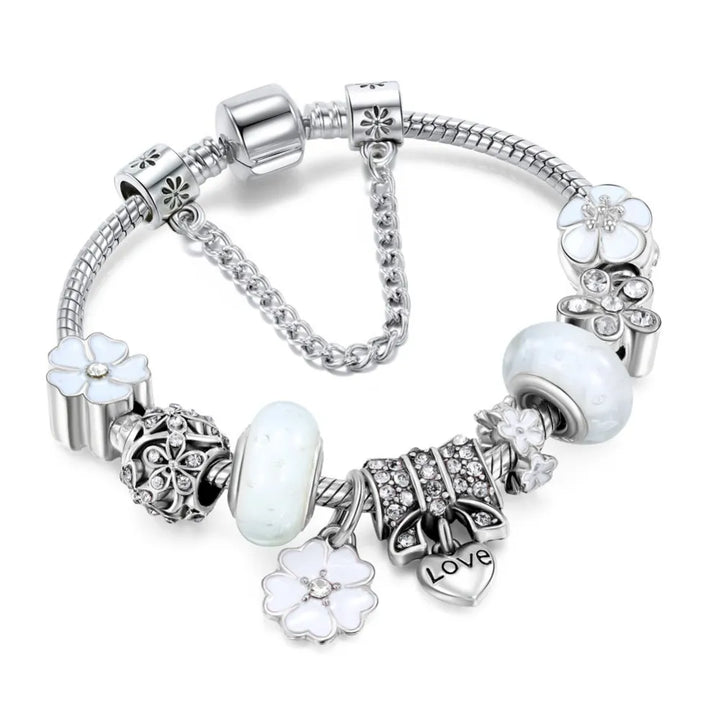 Women's stainless steel peach blossom bracelet with detailed floral charms, an exquisite gift for her.