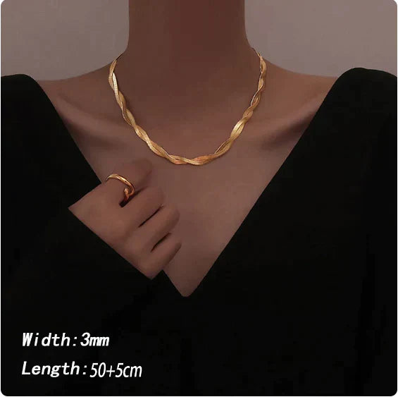 Women's elegant stainless steel twist design necklace and bracelet jewellery set. Stylish accessory.