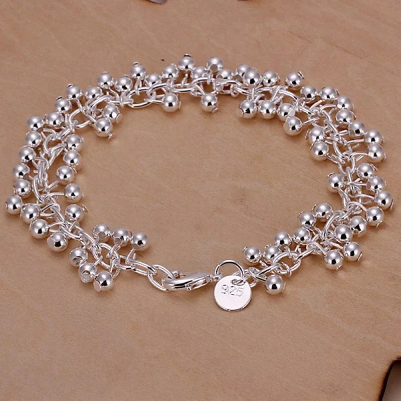 Delicate silver bead bracelet for women, adjustable and ideal for everyday wear or special occasions.
