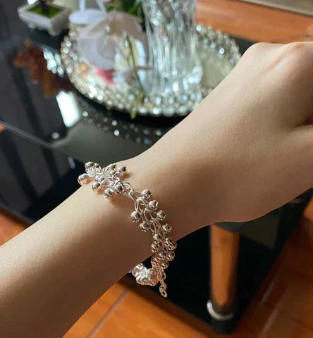 Close-up: Shimmering sterling silver bead bracelet, showcasing its elegant design & quality craftsmanship.